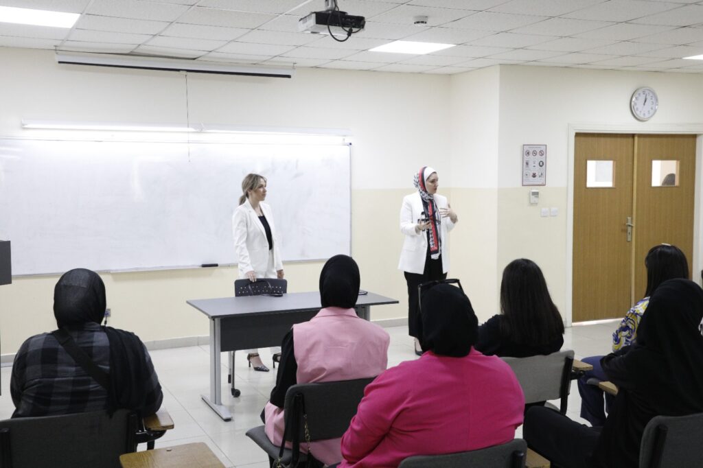 Students from the Faculty of Law at Middle East University engage in a discussion with an expert on labor law and social security.